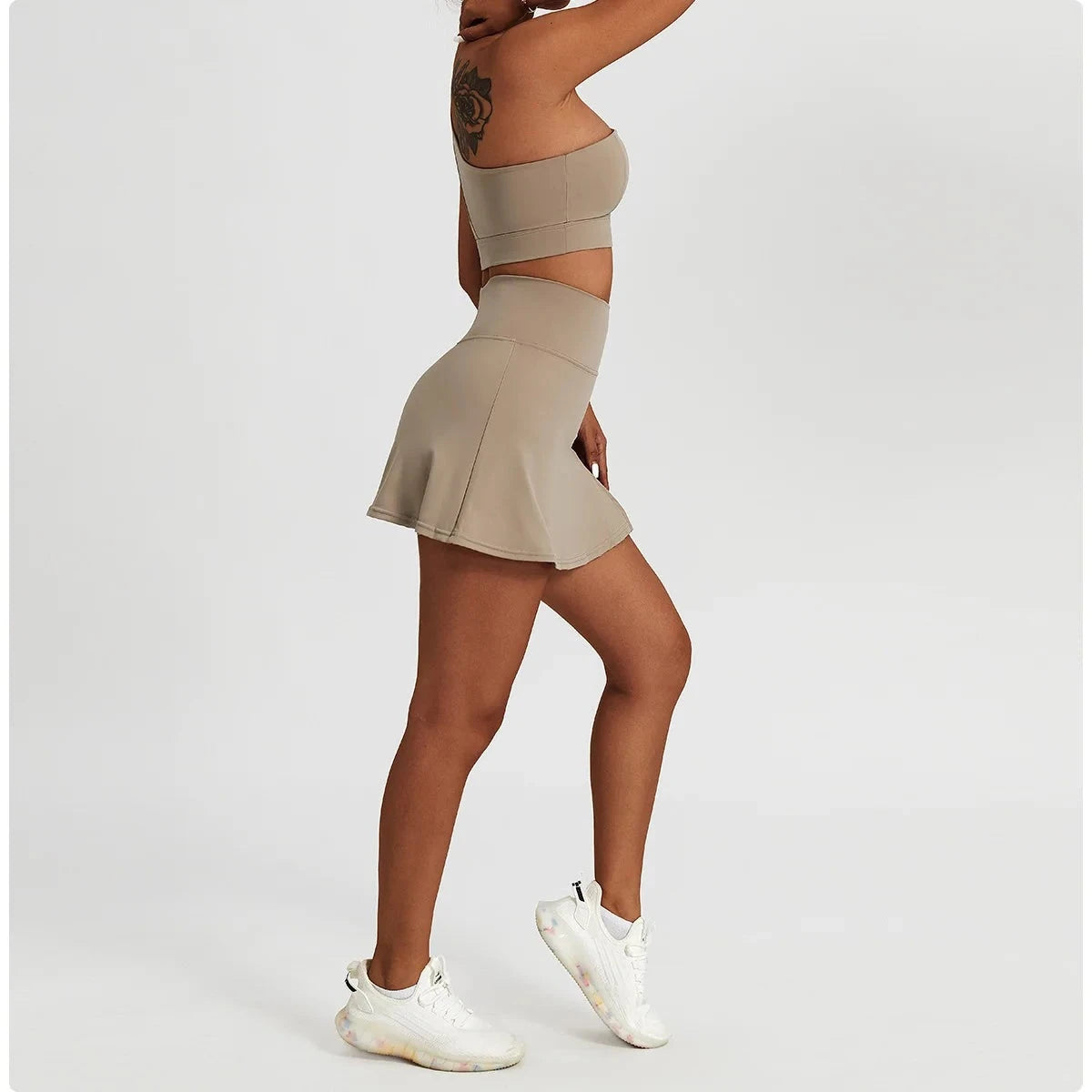 "Effortless Sophistication: The Elite One-Shoulder Sports Bra & Skirt Ensemble"